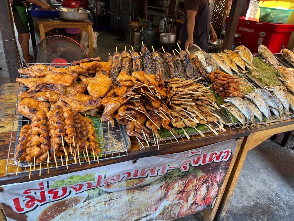 Showing a vender selling Fish on a stick