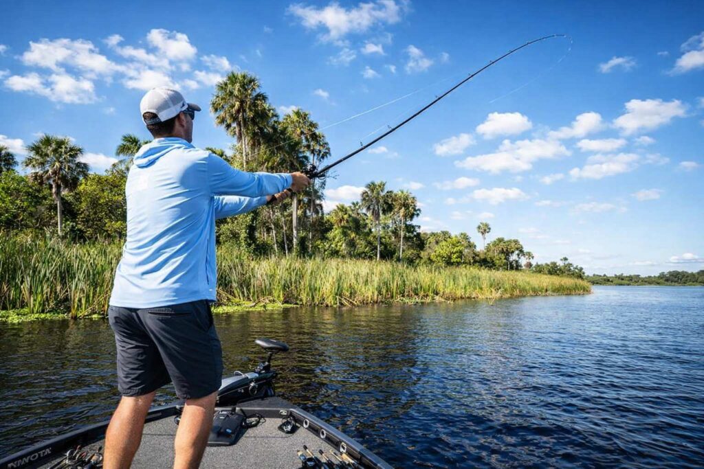 man on a bass boat, casting